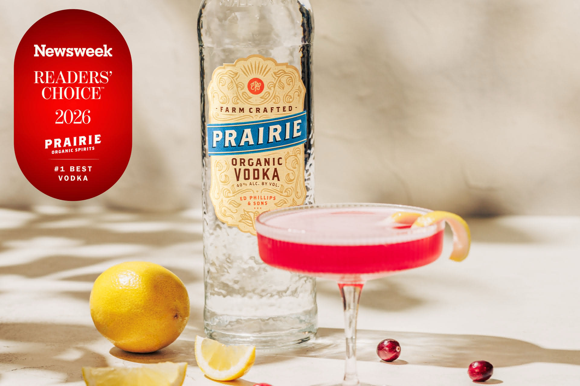 Prairie Organic Vodka bottle with a pink cranberry-lemon cocktail, named Newsweek's #1 Best Vodka 2026