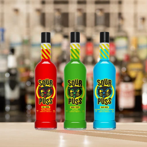 Three bottles of different colored Sour Puss schnapps on a bar