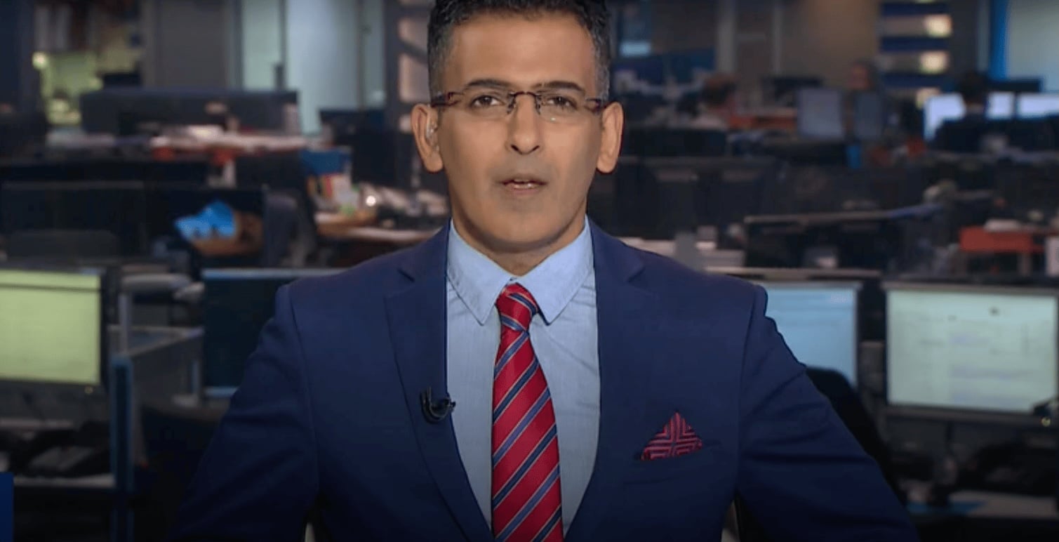 News reporter in a dark suit