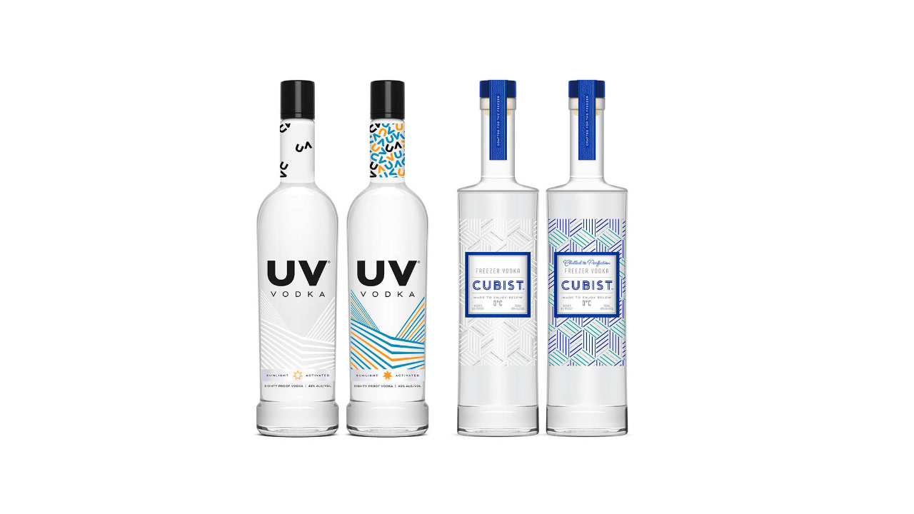 Two bottles of Cubist and UV vodka on a white background