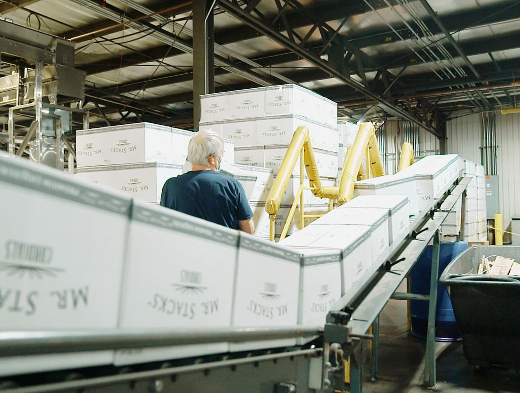 Bottles on a conveyor belt moving quickly